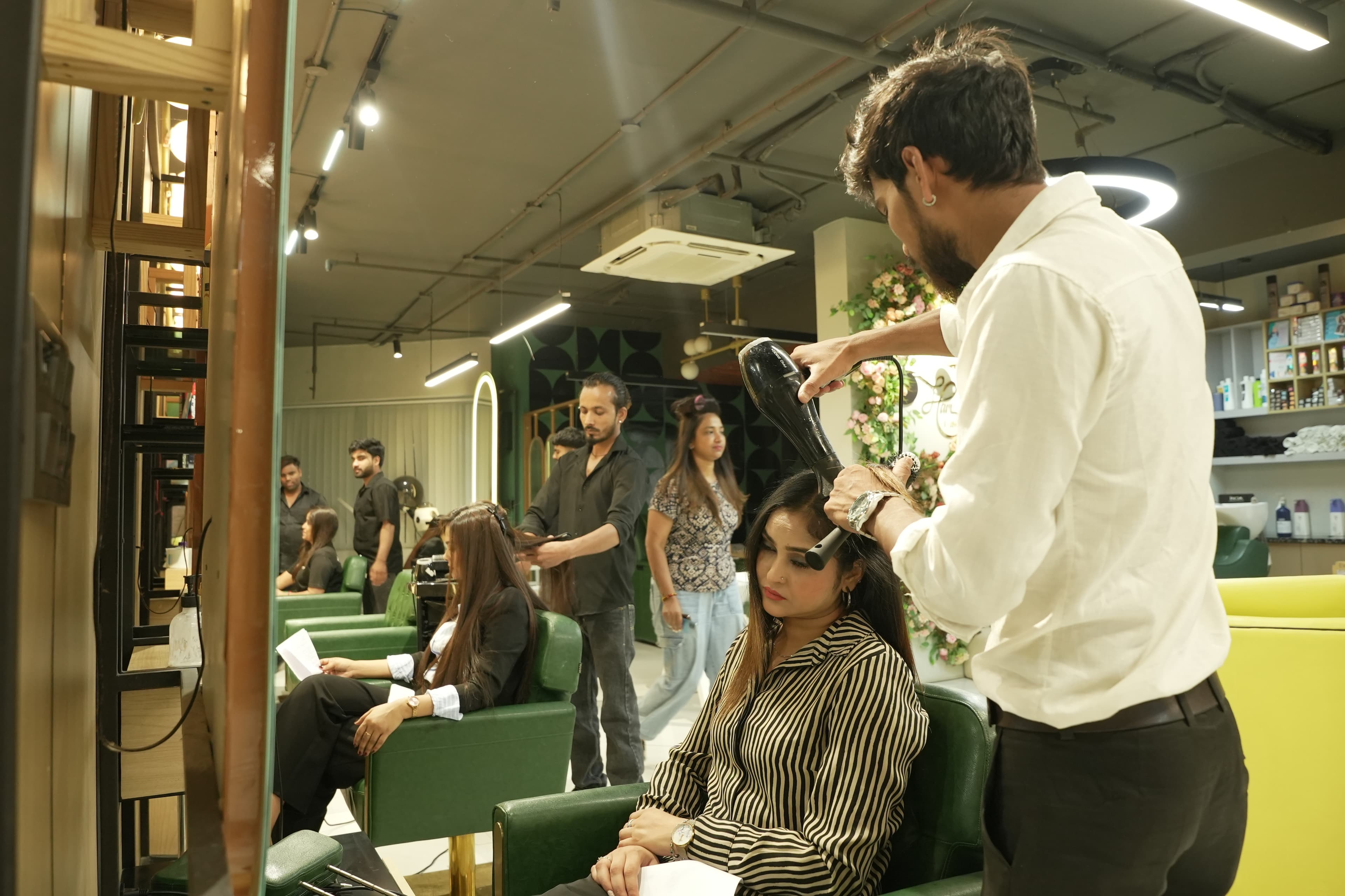 Doing hairstyling on a model's hair